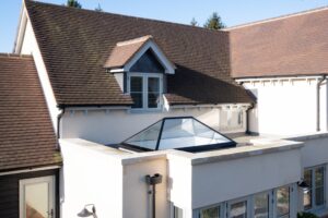 A modern lean-to conservatory featuring a sleek skypod roof lantern, flooding the space with natural light.